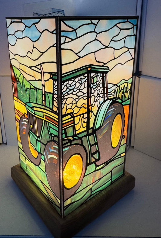 Stained glass lamp with a tractor design 